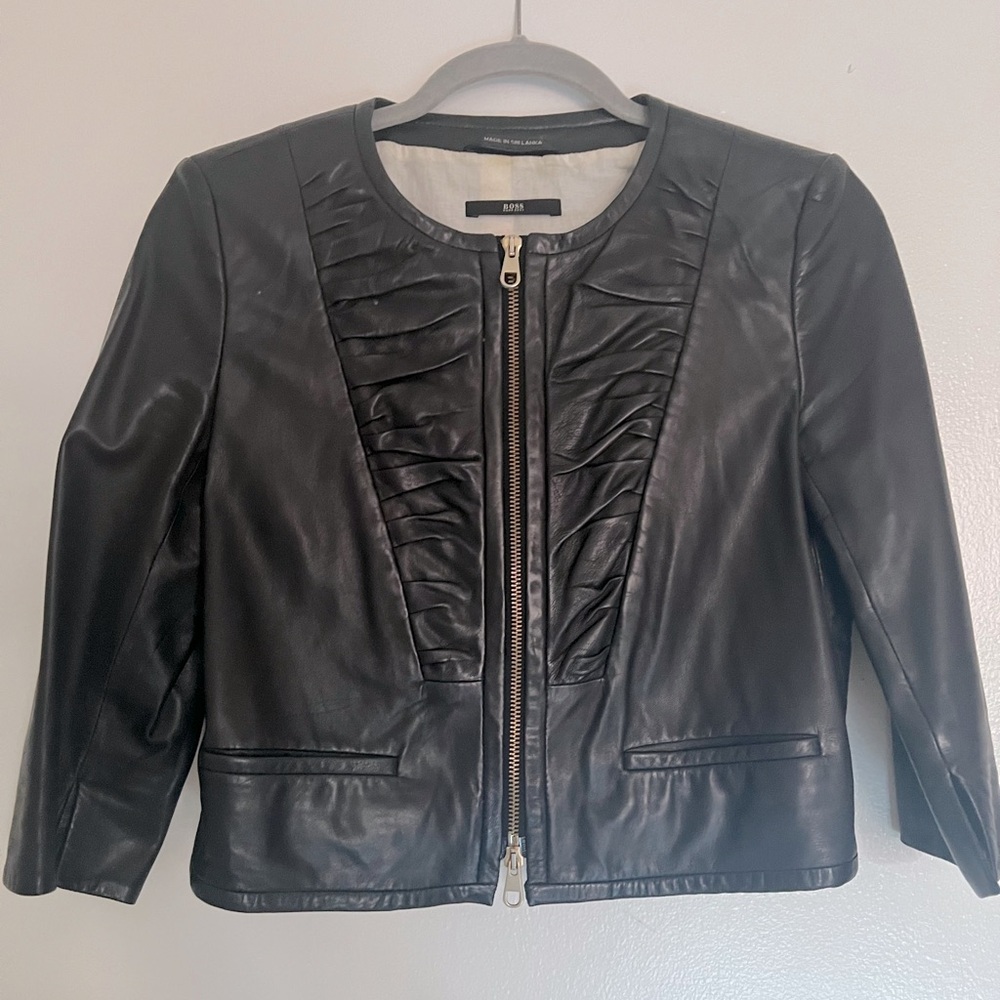 Bolero leather jacket gold color zipper with two little pockets not functional.